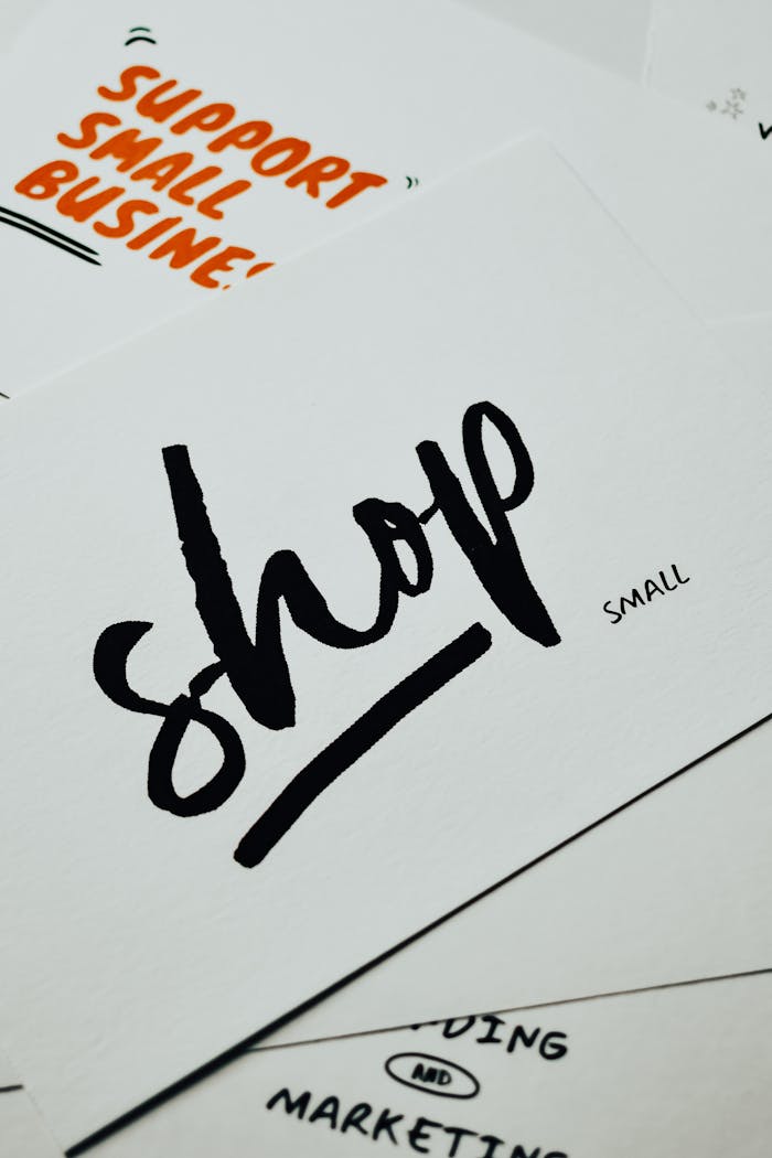 A close-up of a card with 'shop small' message promoting local small businesses.